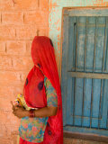 Portrait of Woman in Red Sari Against School Wall  Jodhpur  Rajasthan  India