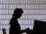 Silhouette of Woman Working on Computer