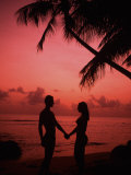 Couple Enjoying a Romantic Sunset on the Beach