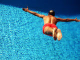 Middle-Aged Man Diving into Swimming Pool
