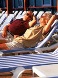Retired Couple Lounging in Deck Chairs on a Cruise Ship