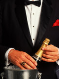 Waiter in Tuxedo with Bottle of Chilled Champagne