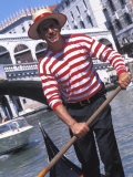 Gondolier Navigating a Gondola  Venice  Italy