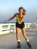 Young Woman on Rollerblades at the Beach
