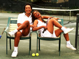 Healthy African American Couple Relaxing on Tennis Court
