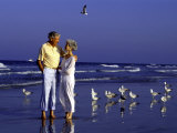 Retired Couple Relaxing on the Beach