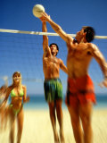 Couples Playing Volleyball on the Beach