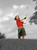 Woman Hitting Golf Ball