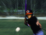 Baseball Player Hitting the Ball