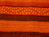 Detail of Handmade Orange and Black Wool Textile Blanket  Pisac Market  Peru