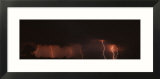 Forked Lightning under Dramatic Cloud Striking over a Field