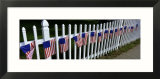 American Flags Hanging on a Picket Fence