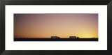 Silhouette of Two Trucks Moving on a Highway  Interstate 5  California  USA