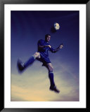 "Low Section View of a Soccer Player Jumping in Mid Air to Head a Soccer Ball" Pre-made-framed Framed Art Print