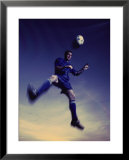 "Low Section View of a Soccer Player Jumping in Mid Air to Head a Soccer Ball" Pre-made-framed Framed Art Print