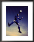 "Low Section View of a Soccer Player Jumping in Mid Air to Head a Soccer Ball" Pre-made-framed Framed Art Print
