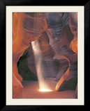 Sunbeam Illuminates Sandy Floor and Sandstone Walls of a Slot Canyon  Antelope Canyon  Page