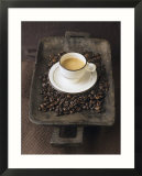 A Cup of Espresso on a Wooden Bowl with Coffee Beans