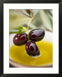 Dipping Olive Sprig with Black Olives in Olive Oil