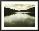 Water Reflecting Bordering Trees and Sky