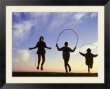 Silhouette of Children Jumping Rope Outdoors