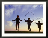 Silhouette of Children Jumping Rope Outdoors