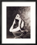 Ballerina stretching over table