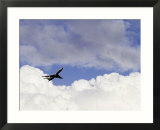 Commercial airplane soaring above the clouds