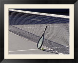 Tennis Racquet Against Net with Ball