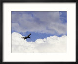 Commercial airplane soaring above the clouds