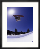 Airborne snowboarder in half pipe position