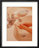 Young Girl Washing Hands in Sink