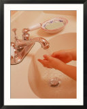 Young Girl Washing Hands in Sink