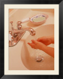 Young Girl Washing Hands in Sink