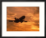 Silhouette of commercial airplane at sunset