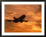 Silhouette of commercial airplane at sunset