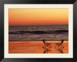 Silhouette of two chairs on the beach