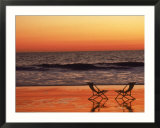 Silhouette of two chairs on the beach