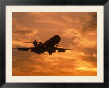 Silhouette of commercial airplane at sunset