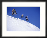 Snowboarders Jumping Off Overhang  CO