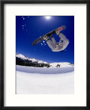 Snowboarder upside down in midair