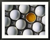 Cracked Egg In The Middle Of Other Eggs