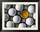 Cracked Egg In The Middle Of Other Eggs