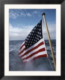 An American flag flutters from the back of a boat in Neah Bay