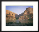 The Colorado River flows past Hole-in-the-Rock