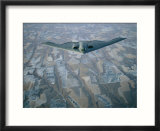 A B-2 Stealth bomber flies above the patterned terrain of southwestern Nebraska