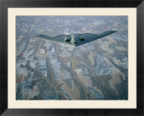 A B-2 Stealth bomber flies above the patterned terrain of southwestern Nebraska