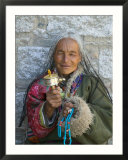 Tibetan Woman Holding Praying Wheel in Sakya Monastery  Tibet  China
