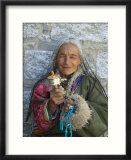 Tibetan Woman Holding Praying Wheel in Sakya Monastery  Tibet  China