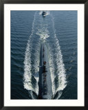 A Los Angeles-class attack submarine cruises into port